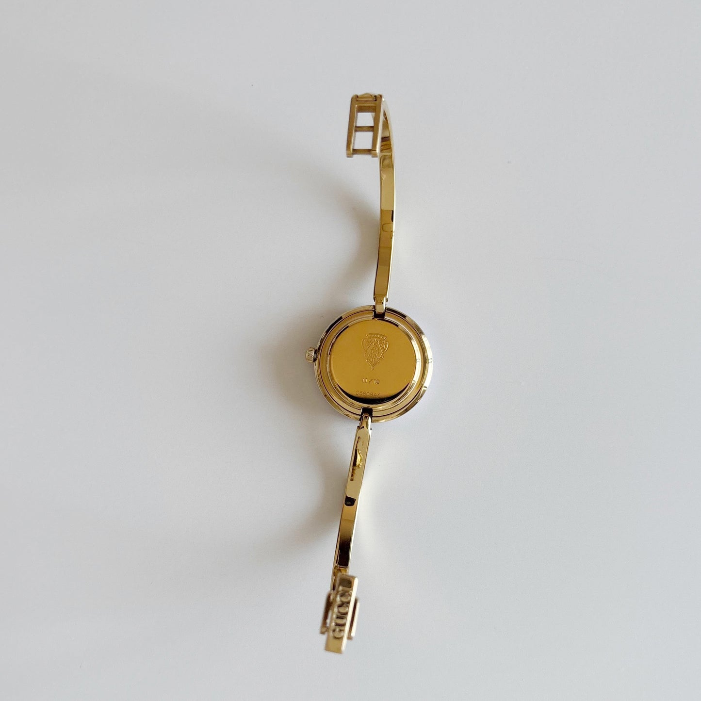 Gucci 1990s Interchangeable Bezel Gold Plated Bangle Watch with 12 bezels, case