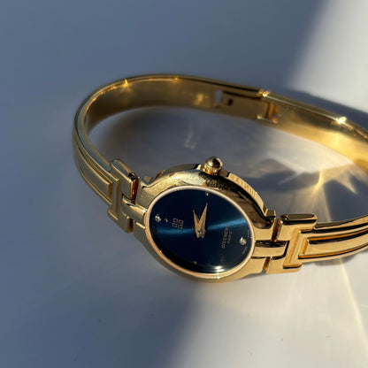 Givenchy 1990s Navy Round Dial Gold Plated Bangle Watch