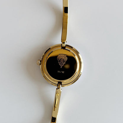 Gucci 1990s Interchangeable Bezel Gold Plated Bangle Watch with 12 bezels, case