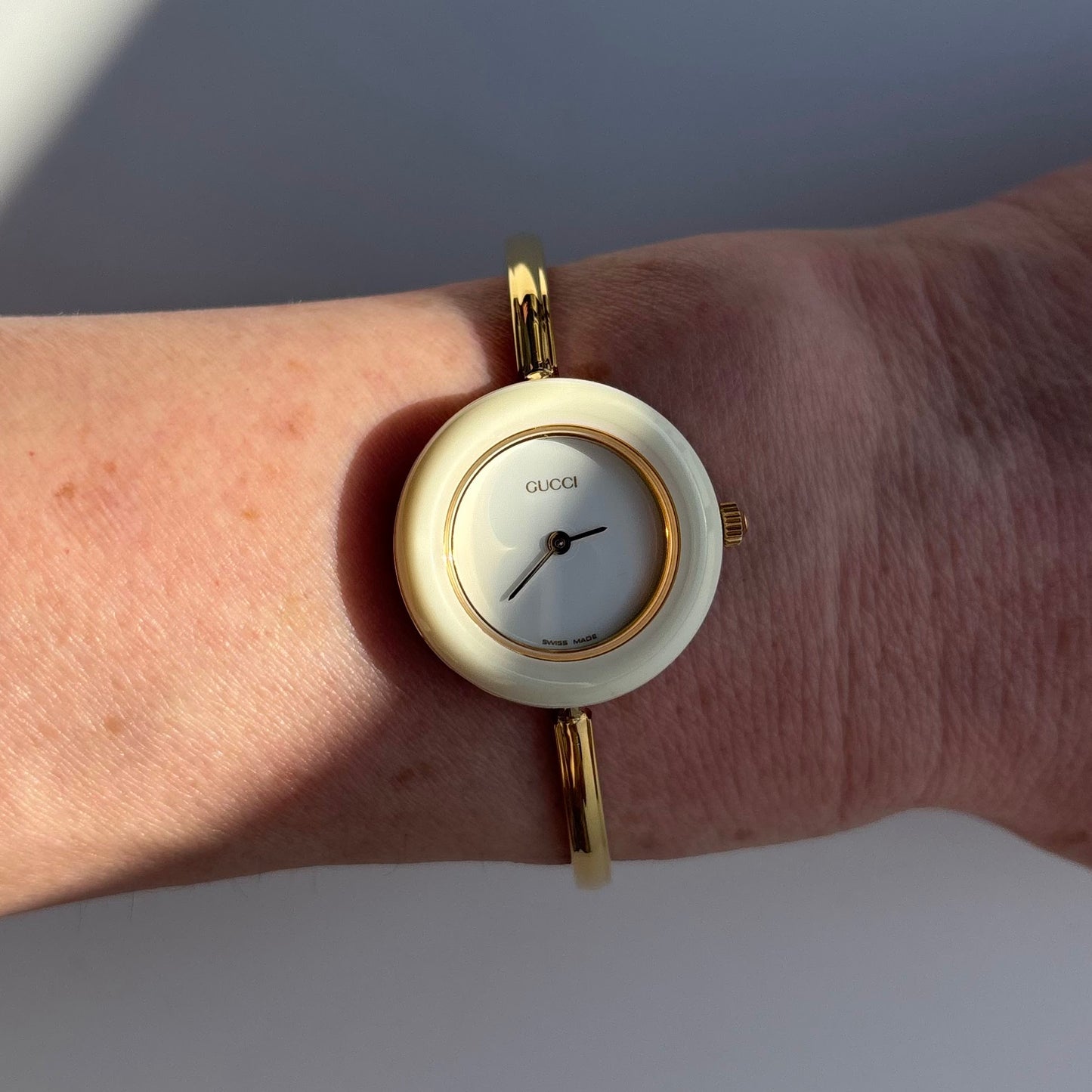 Gucci 1990s Interchangeable Bezel Gold Plated Bangle Watch with 12 bezels, case