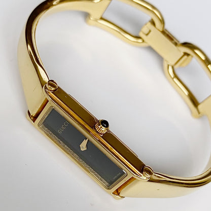 Gucci 1990s Black Dial Rectangular Gold Plated Bangle Watch