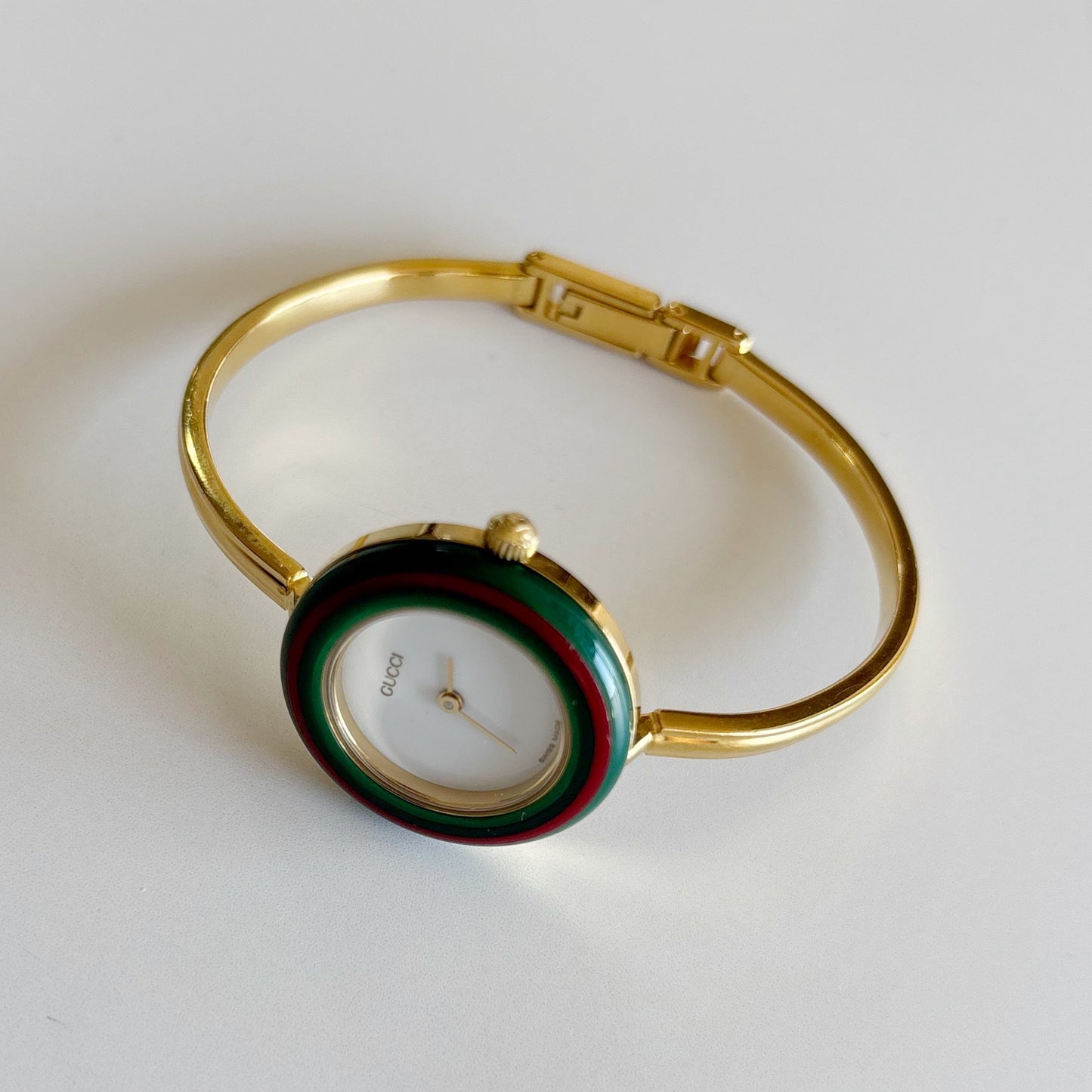 Gucci 1990s Interchangeable Bezel Gold Plated Bangle Watch with 12 bezels, case