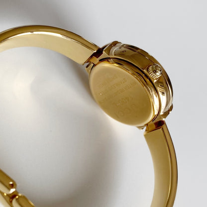 Gucci 1990s Round Dial Gold Plated Bangle Watch