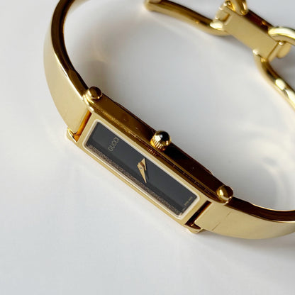 Gucci 1990s Black Dial Gold Plated Bangle Watch