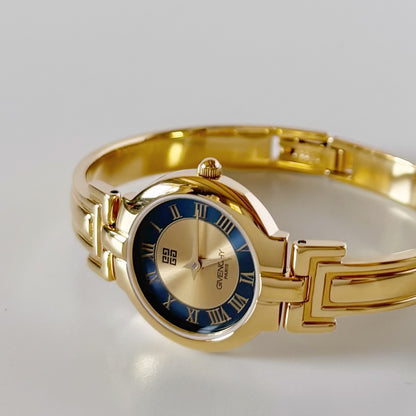 Givenchy 1990s Round Dial Gold Plated Bangle Watch