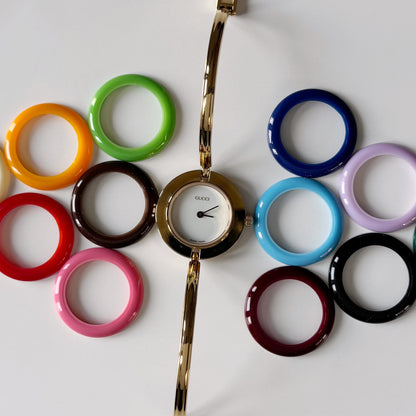 Gucci 1990s Interchangeable Bezel Gold Plated Bangle Watch with 12 bezels, case