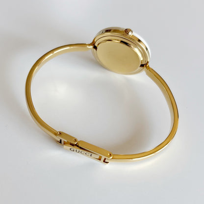 Gucci 1990s Interchangeable Bezel Gold Plated Bangle Watch with 12 bezels, case