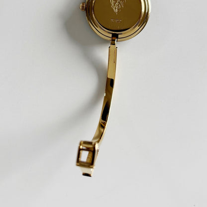 Gucci 1990s Interchangeable Bezel Gold Plated Bangle Watch with 12 bezels, case