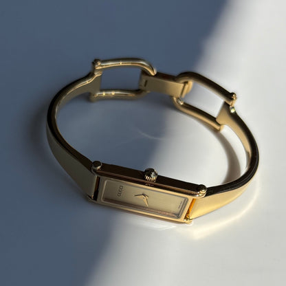 Gucci 1990s Gold Rectangular Dial Gold Plated Bangle Watch