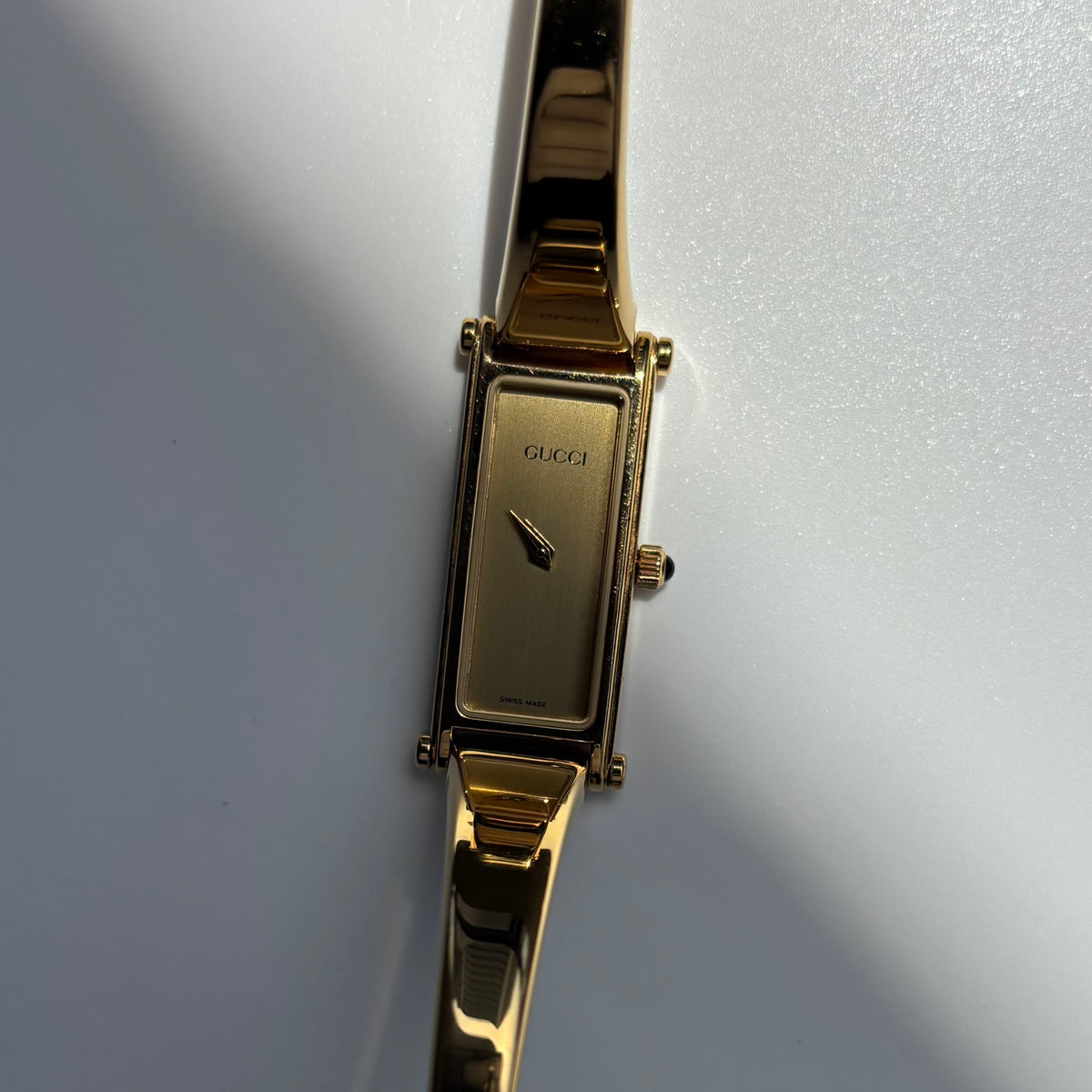Gucci 1990s Rectangular Gold Dial Gold Plated Bangle Watch