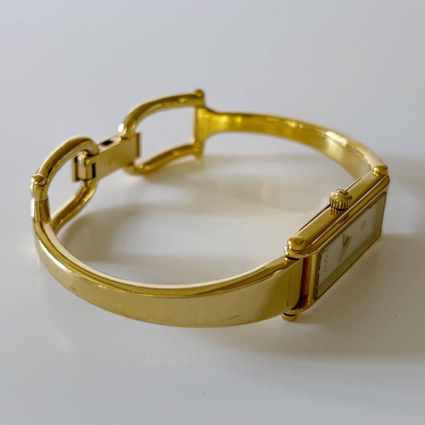 Gucci 1990s Rectangular White Dial Gold Plated Bangle Watch