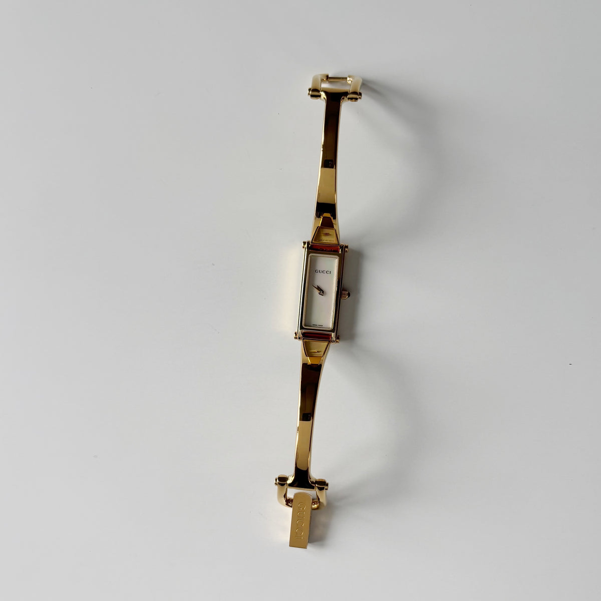 Gucci 1990s Seashell Dial Rectangular Gold-Plated Bangle Watch