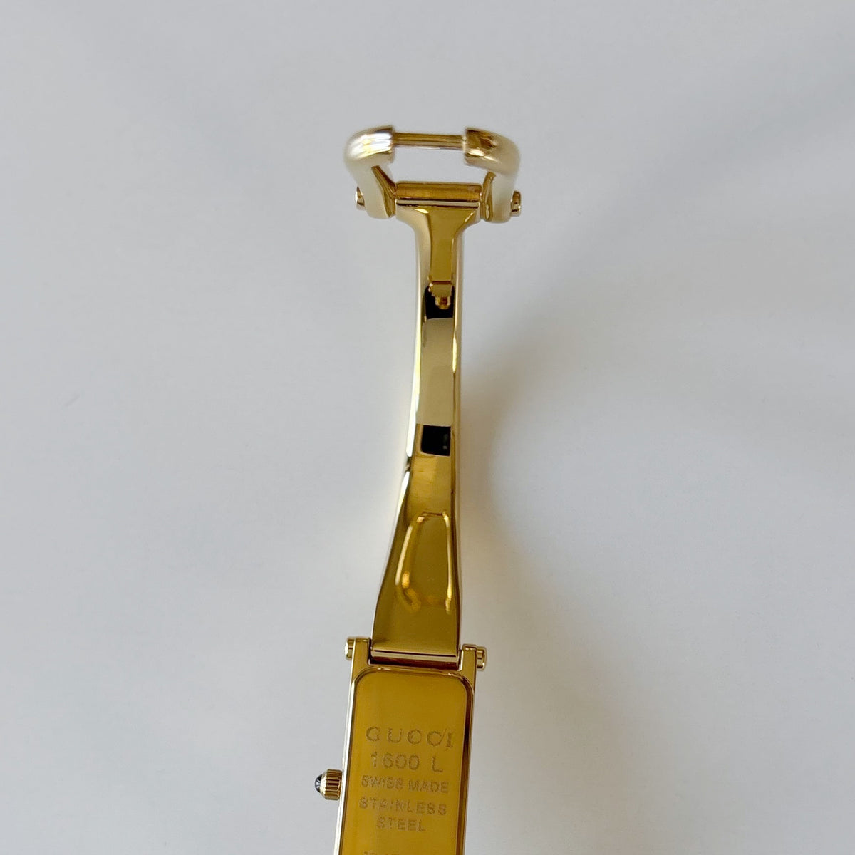 Gucci 1990s Rectangular Gold Dial Gold-Plated Watch