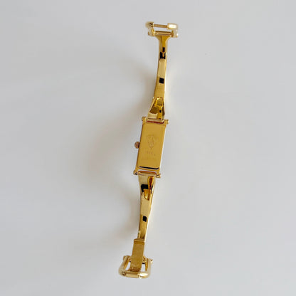 Gucci 1990s Black Rectangular Dial Gold Plated Bangle Watch