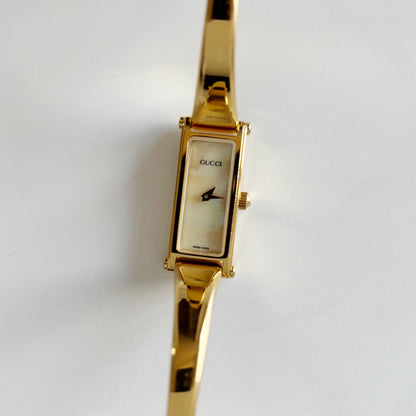Gucci 1990s Rectangular Seashell Dial Gold Plated Bangle Watch