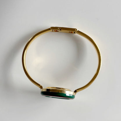 Gucci 1990s Interchangeable Bezel Gold Plated Bangle Watch with 12 bezels, case