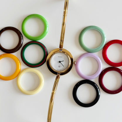 Gucci 1990s Interchangeable Bezel Gold Plated Bangle Watch with 12 bezels, case