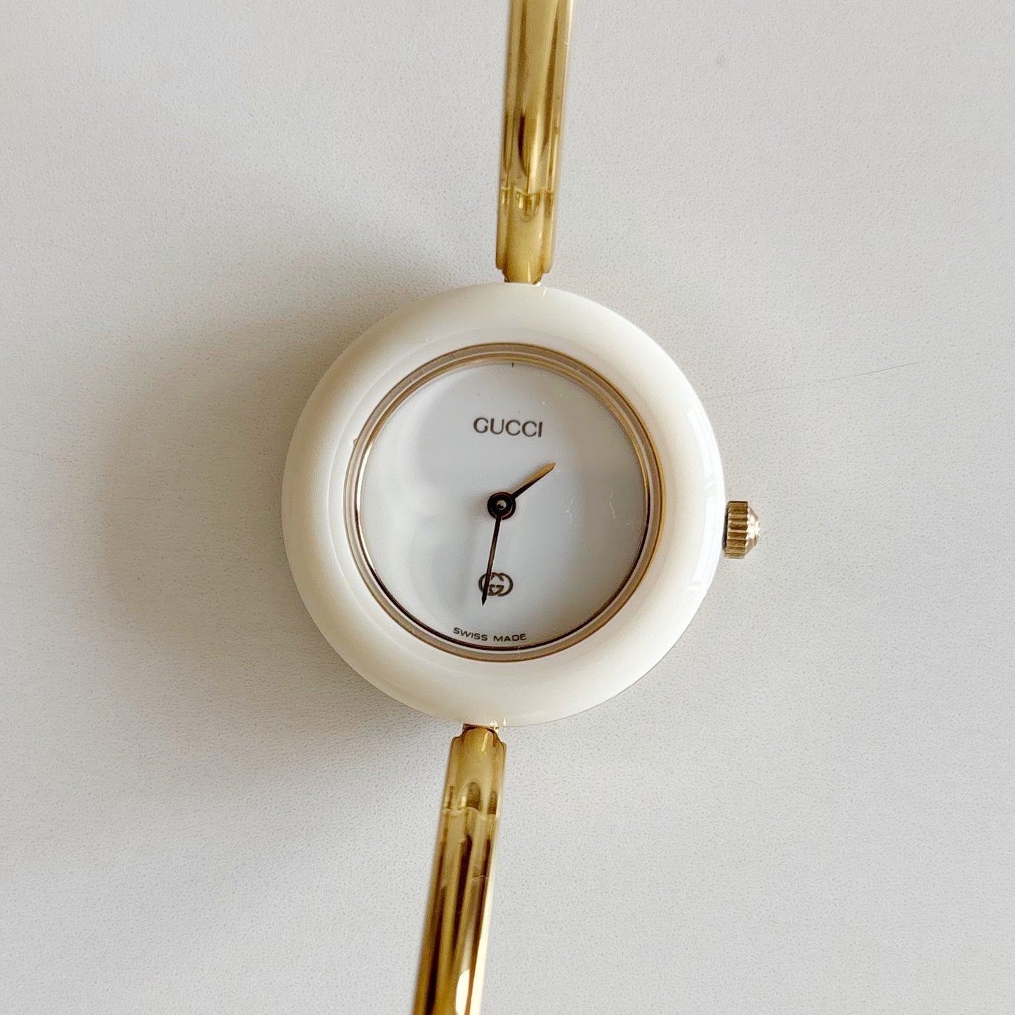 Gucci 1990s Interchangeable Bezel Gold Plated Bangle Watch with 12 bezels, case