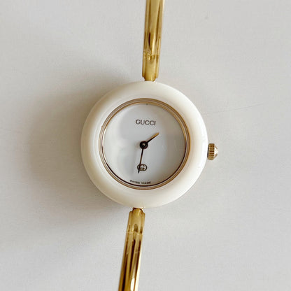 Gucci 1990s Interchangeable Bezel Gold Plated Bangle Watch with 12 bezels, case