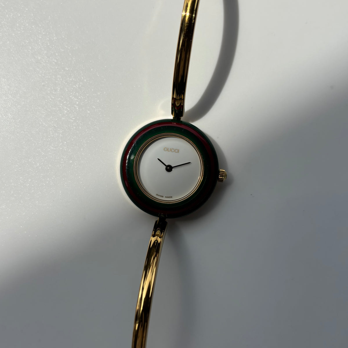Gucci 1990s Interchangeable Bezel Gold Plated Bangle Watch with 12 bezels, case