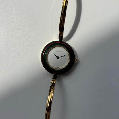 Gucci 1990s Interchangeable Bezel Gold Plated Bangle Watch with 12 bezels, case