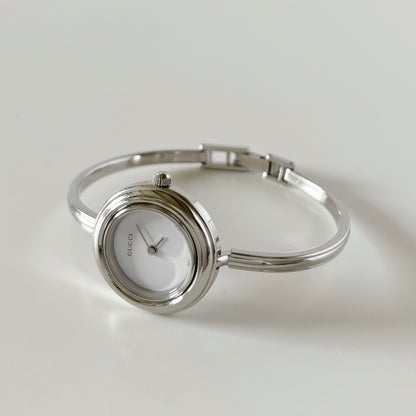 Gucci 1990s Interchangeable Bezel Stainless steel Bangle Watch with 12 bezels, case