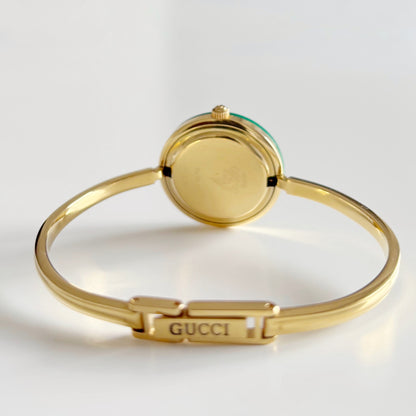 Gucci 1990s Interchangeable Bezel Gold Plated Bangle Watch with 12 bezels, case
