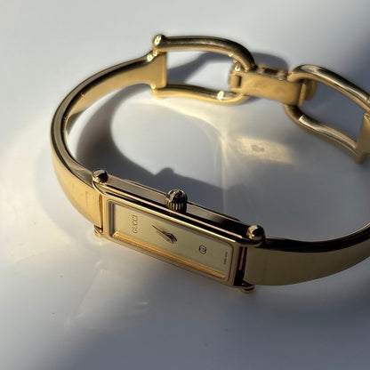 Gucci 1980s Rectangular Gold Dial Gold Plated Bangle Watch