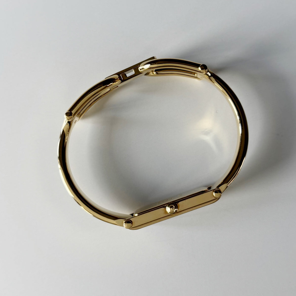 Gucci 1990s Rectangular Gold Dial Gold Plated Bangle Watch (Small)