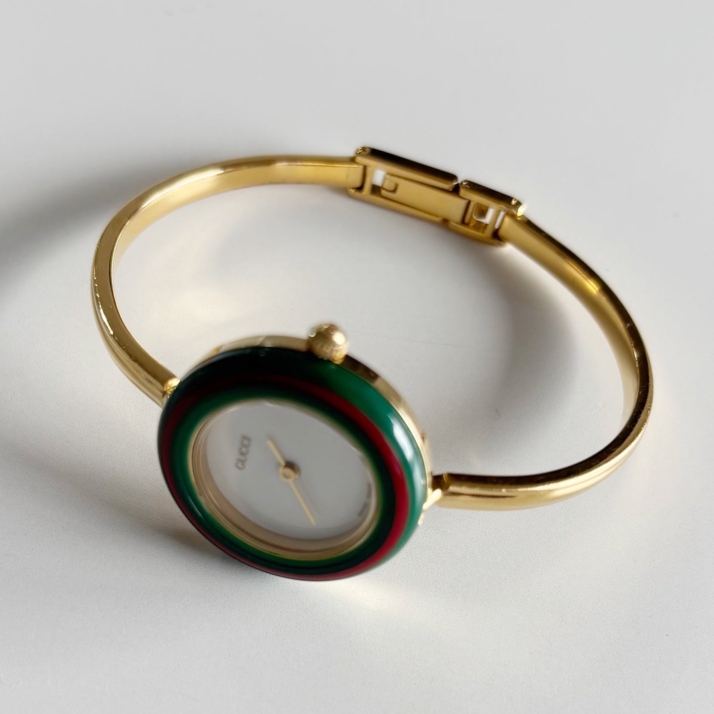 Gucci 1990s Interchangeable Bezel Gold Plated Bangle Watch with 12 bezels, case