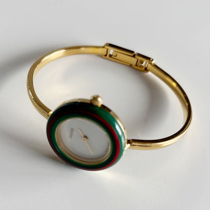 Gucci 1990s Interchangeable Bezel Gold Plated Bangle Watch with 12 bezels, case