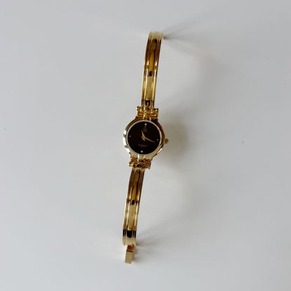 Givenchy 1990s Black Round Dial Gold Plated Bangle Watch