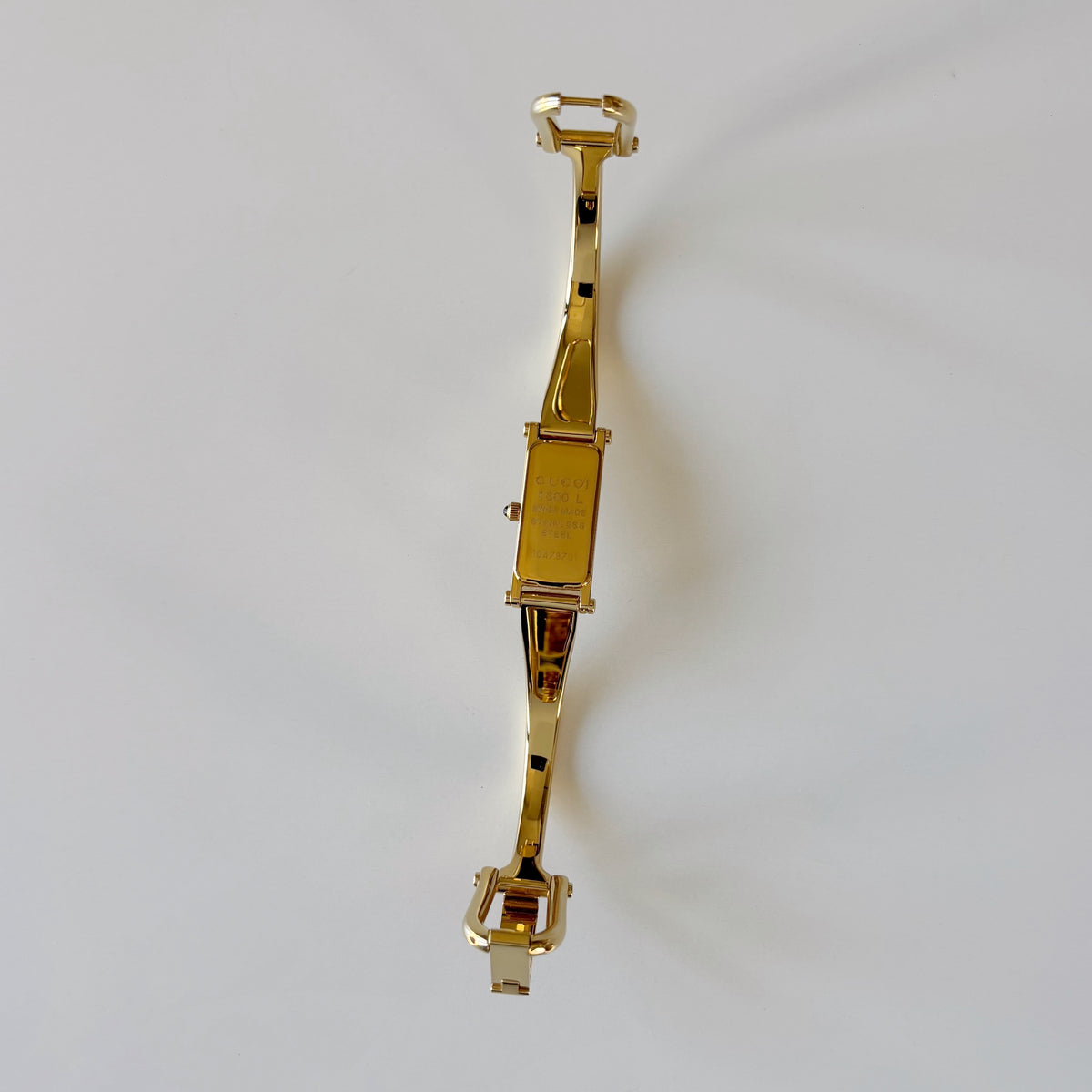 Gucci 1990s Rectangular Gold Dial Gold-Plated Watch