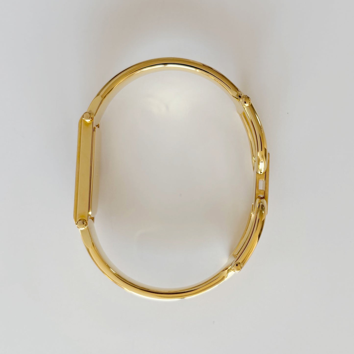 Gucci 1990s Black Rectangular Dial Gold Plated Bangle Watch