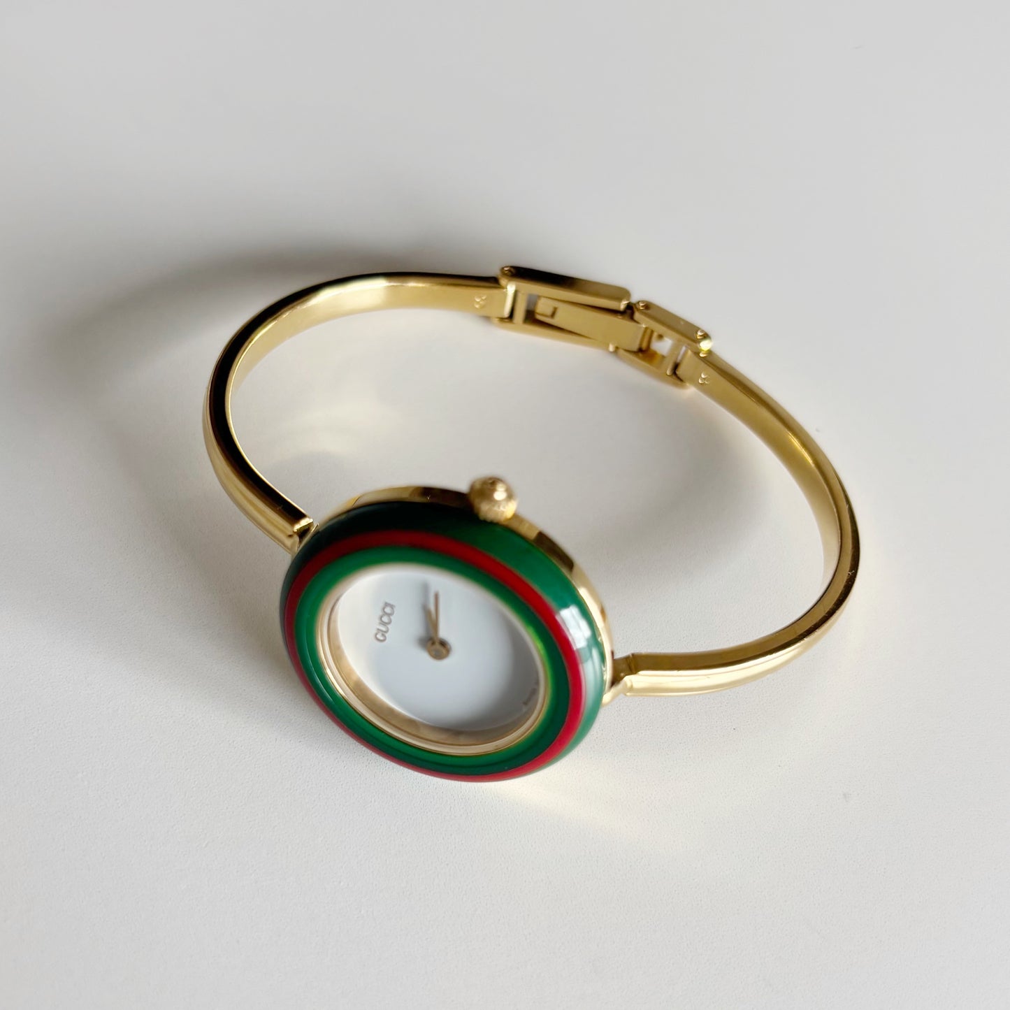 Gucci 1990s Interchangeable Bezel Gold Plated Bangle Watch with 12 bezels, case (Small)
