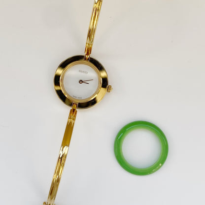 Gucci 1990s Interchangeable Bezel Gold Plated Bangle Watch with 12 bezels, Case