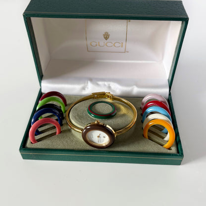 Gucci 1990s Interchangeable Bezel Gold Plated Bangle Watch with 12 bezels, case