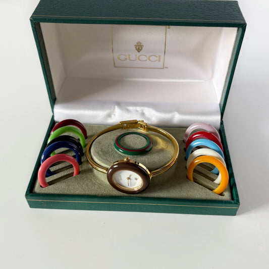 Gucci 1990s Interchangeable Bezel Gold Plated Bangle Watch with 12 bezels, case