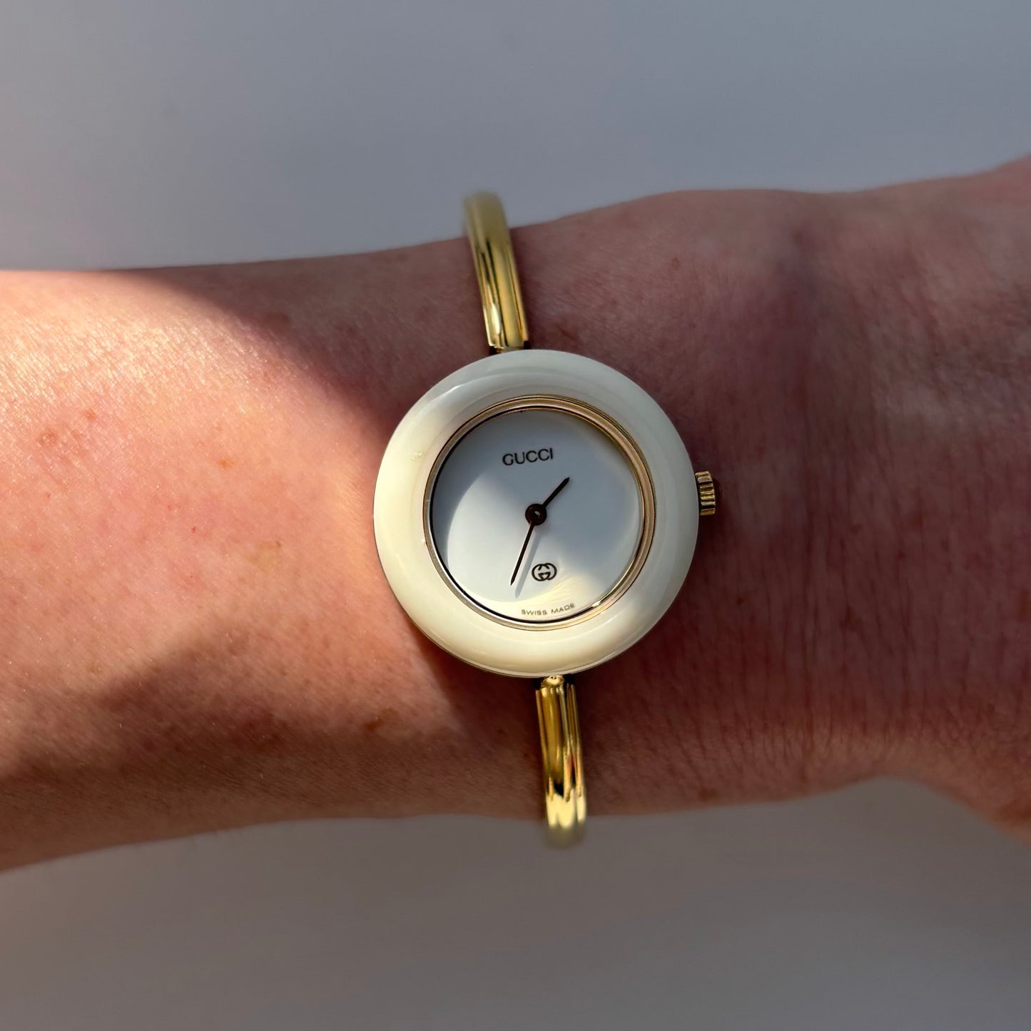 Gucci 1990s Interchangeable Bezel Gold Plated Bangle Watch with 12 bezels, case