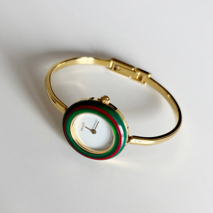 Gucci 1990s Interchangeable Bezel Gold Plated Bangle Watch with 12 bezels, case