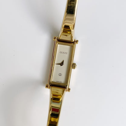 Gucci 1990s Rectangular White Dial Gold Plated Bangle Watch