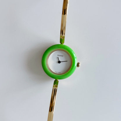 Gucci 1990s Interchangeable Bezel Gold Plated Bangle Watch with 12 bezels, case