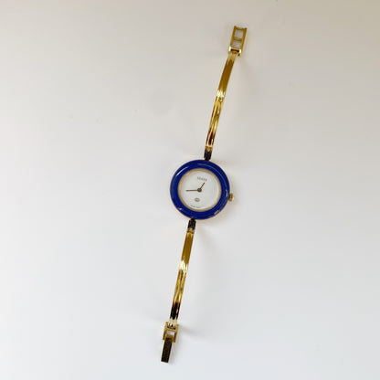 Gucci 1990s Interchangeable Bezel Gold Plated Bangle Watch with 12 bezels, case