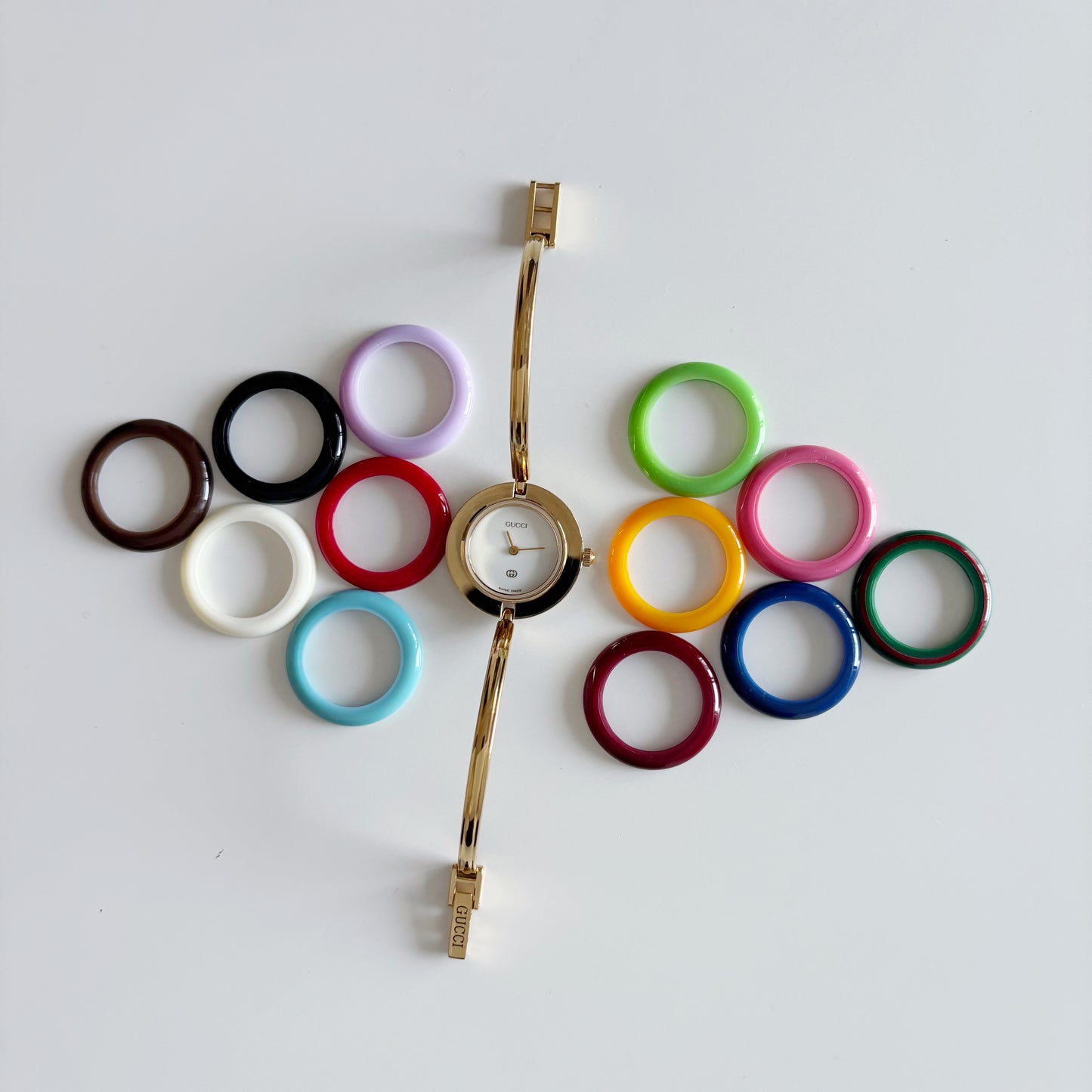 Gucci 1990s Interchangeable Bezel Gold Plated Bangle Watch with 12 bezels, case