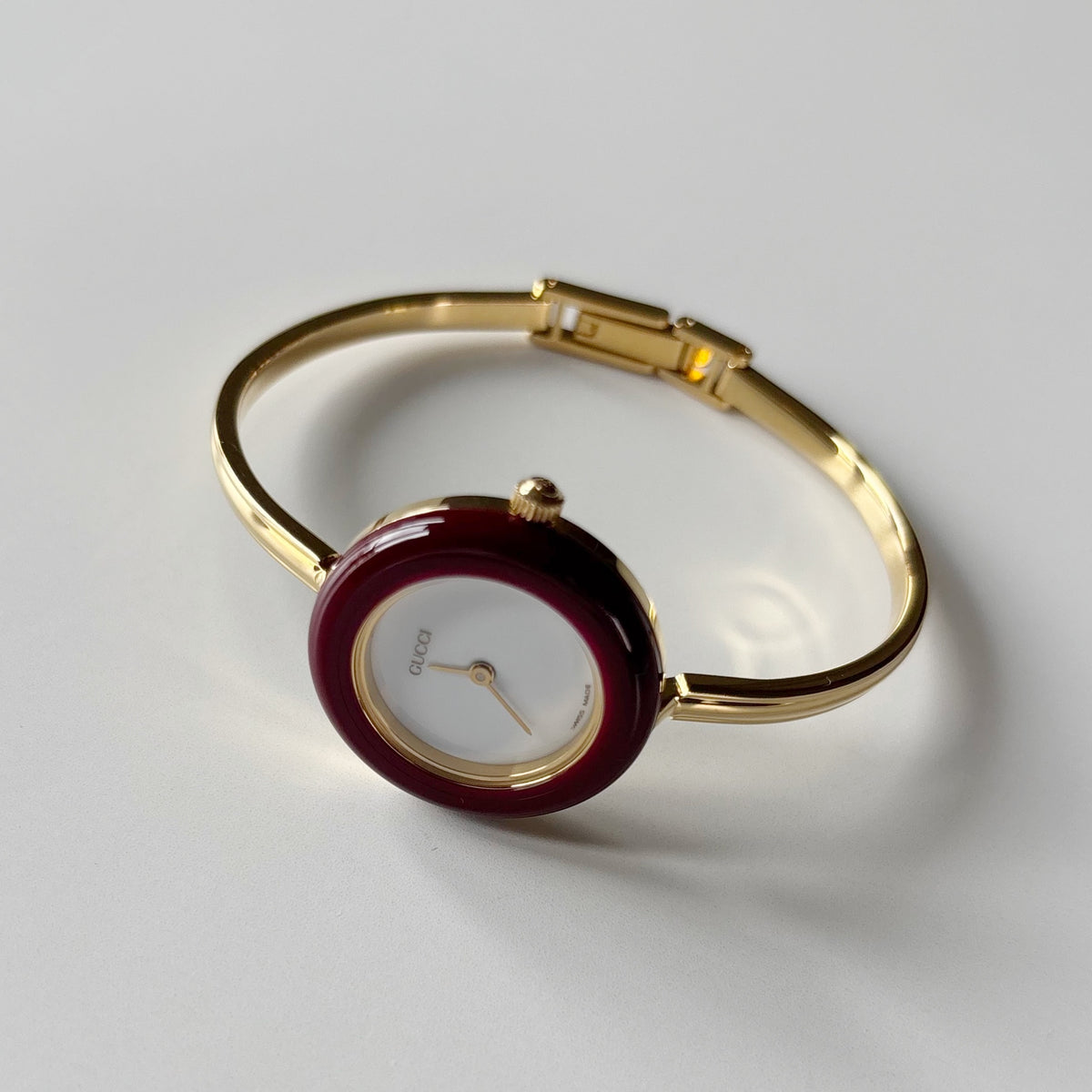 Gucci 1990s Interchangeable Bezel Gold Plated Bangle Watch with 12 bezels, case