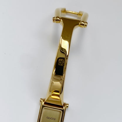 Gucci 1990s Rectangular Gold Dial Gold Plated Bangle Watch (Small)