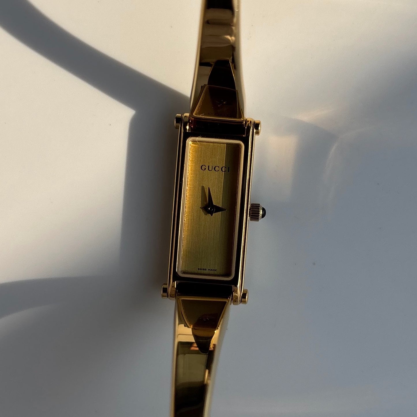 Gucci 1990s Rectangular Gold Dial Gold Plated Bangle Watch