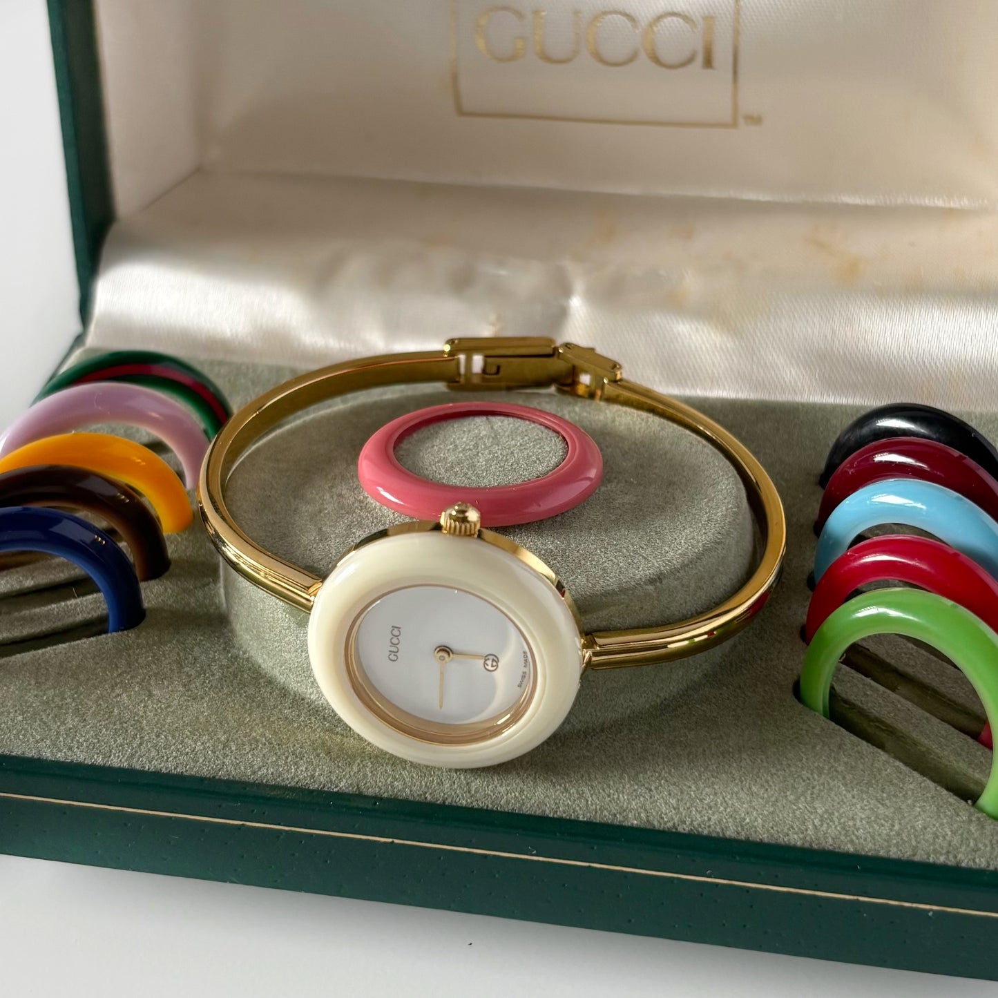 Gucci 1990s Interchangeable Bezel Gold Plated Bangle Watch with 12 bezels, case