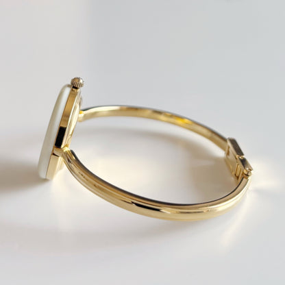 Gucci 1990s Interchangeable Bezel Gold Plated Bangle Watch with 12 bezels, case