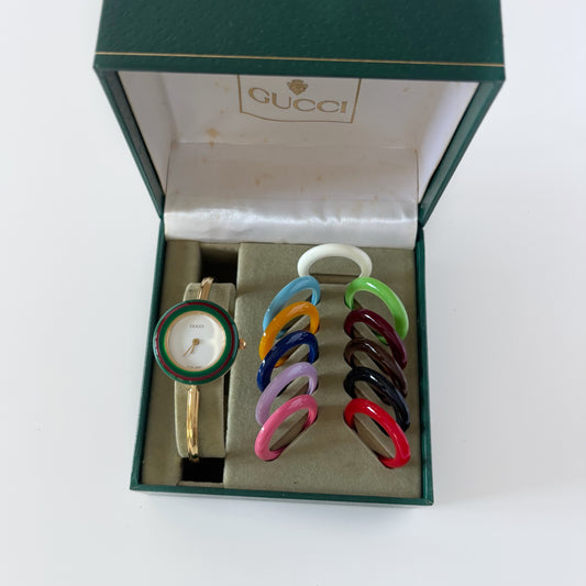 Gucci 1990s Interchangeable Bezel Gold Plated Bangle Watch with 12 bezels, case
